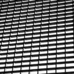 Geometric black and white grid pattern creating an abstract visual effect.