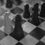 A black and white photo of a chess board